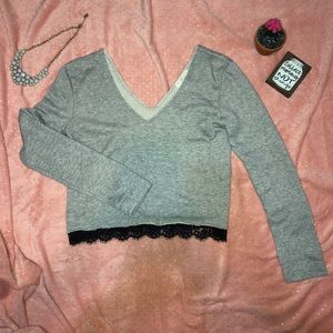 Grey cropped sweater with black lace trim